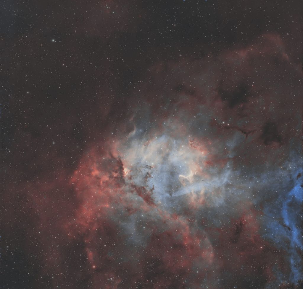Detailed astrophotography capture of the Lion Nebula with rich, glowing textures in H-alpha and OIII.
