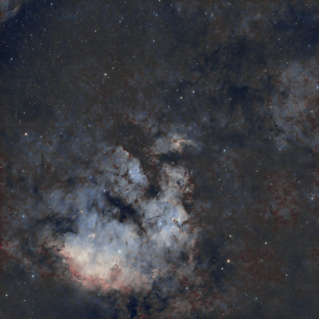Astrophotography of NGC 7822, highlighting its bright star cluster and intricate emission nebula structure.